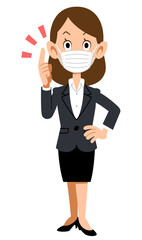 人差し指を立てて話すマスクを付けてスーツを着た女性
