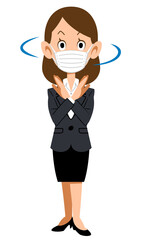 手でバツを作り首をふるマスクを付けてスーツを着た女性
