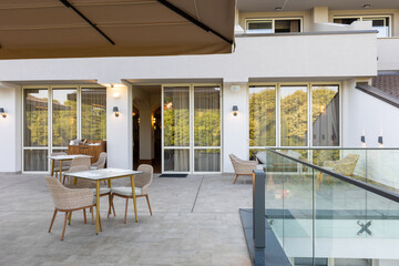 Empty terrace hotel restaurant with sun shades