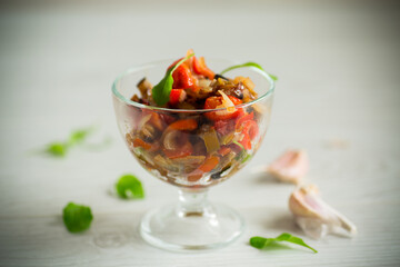 fried eggplants with peppers, tomatoes, onions and garlic
