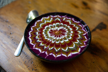 Healthy breakfast made of smoothie bowl in wooden bowl with fresh fruits