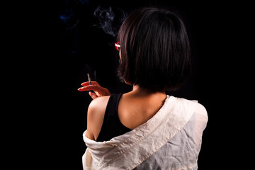 The back of a woman smoking