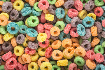 Background of round colorful cereal. Colorful breakfast food. Colorful cereal loop rings.