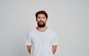 portrait of a bearded man white t-shirt studio cropped view
