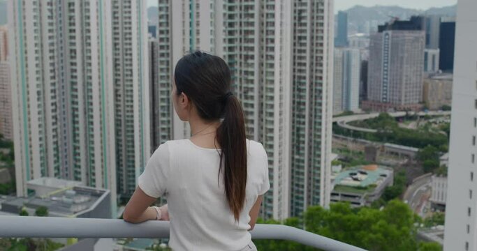 Woman look at the city in Hong Kong