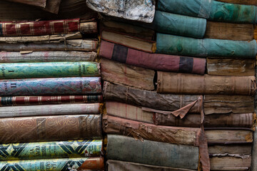 Venice, Italia - August 04 - 2021 Background wallpaper of ancient books piled on top of each other....