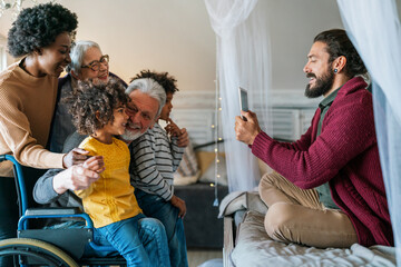 Portrait of happy multi-generation multiethnic family having fun together at home
