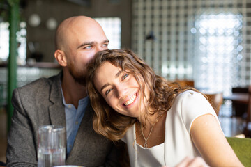 White young happy married couple in the restaurant