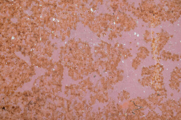 Surface of rusty iron with remnants of old paint, magenta,red texture, background.