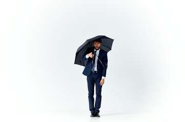 business man in suit umbrella protection self-confidence studio