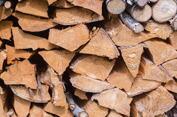 The texture of chopped firewood close-up. Harvesting firewood