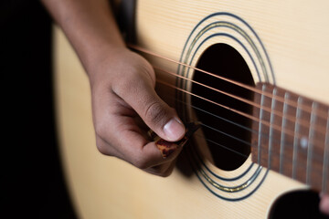 Fototapeta premium Chords on classical wooden guitar