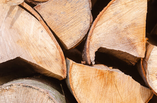 The texture of chopped firewood close-up. Harvesting firewood
