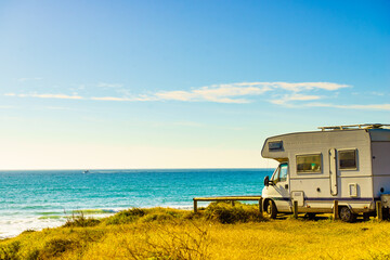 Camper rv camping on sea shore, Spain - obrazy, fototapety, plakaty