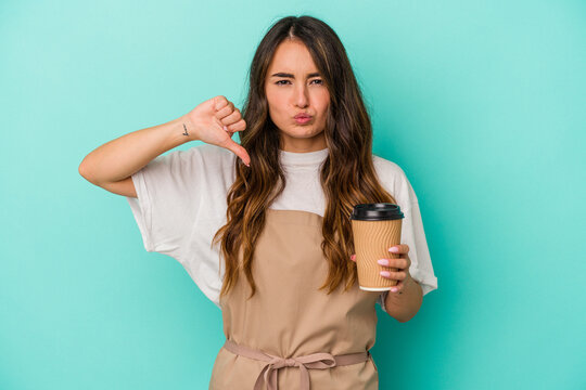 Young Caucasian Store Clerk Woman Holding A Takeaway Coffee Isolated On Blue Background Feels Proud And Self Confident, Example To Follow.