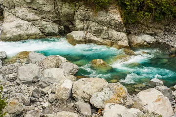 Foto op Plexiglas Blue flowing water of the river in the New Zealand © Fyle