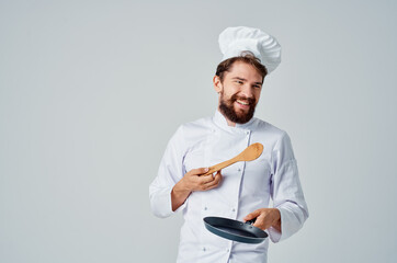 cook with kitchen utensils restaurant kitchen work