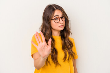 Young caucasian woman isolated on white background rejecting someone showing a gesture of disgust.