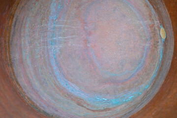Oxidized bottom of a copper pot. Handmade. Copy space.
