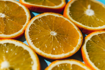 Fresh slices of oranges on the background.