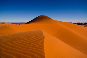 Fototapeta na wymiar Sunset view to Tin Merzouga dune at Tassili nAjjer national park in Algeria