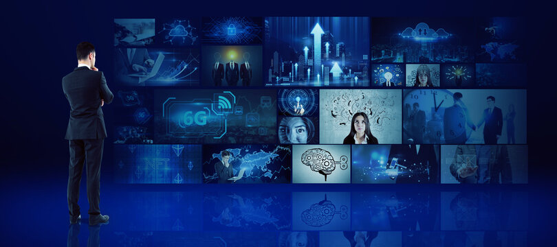 Young european businessman looking at media picture gallery. Digital multimedia concept.
