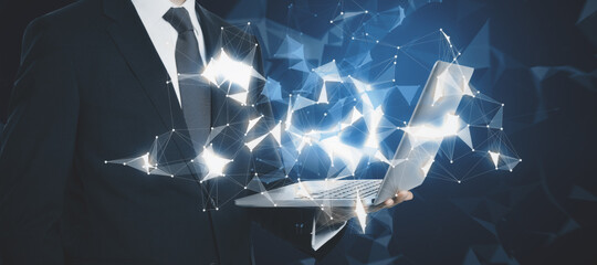 Businessman hands holding laptop with abstract glowing polygonal connections interface on dark background. Web and global networking concept. Double exposure.