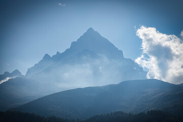 the peak of the monviso shrouded in clouds on a splendid August day. near crissolo, in piedmont