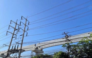 Blue and white sky with electric poles and electric train construction on September 13, 2021,...