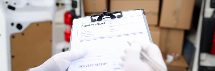 Courier holds receipt for delivery of goods