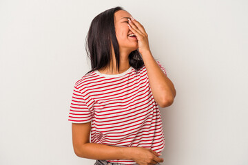 Young latin woman isolated on white background  laughing happy, carefree, natural emotion.