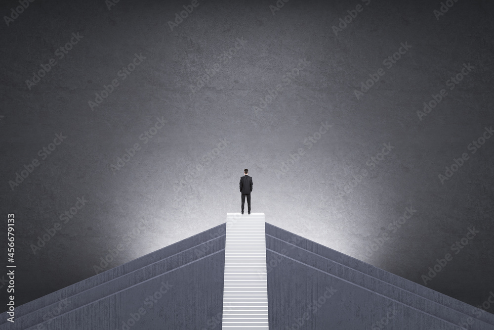 Poster back view of man in suit on top of stairs with mock up place on concrete background. career growth a