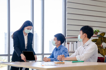 Lady in business dress point her finger on computer screen