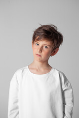 boy in white long sleeve t-shirt