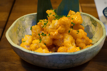 Popcorn shrimp is an appetizer made of tender shrimp that's coated in a seasoned breading, then fried until golden and crispy. 