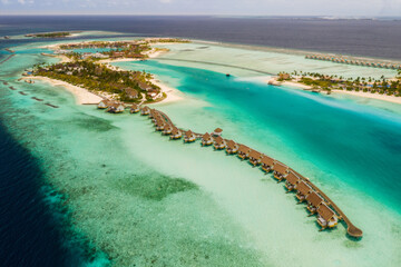 Amazing bird eyes view in Maldives island Eh'mafushi crossroads maldives at sunrise. Aerial drone shot. Saii lagoon and hard rock hotel. July 2021 © Сергій Вовк