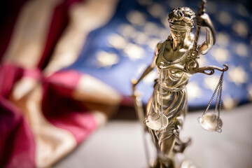American legal system law concept statue of lady justice with scales of justice and american flag - obrazy, fototapety, plakaty