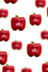 red bell pepper on a white background. pepper in flight