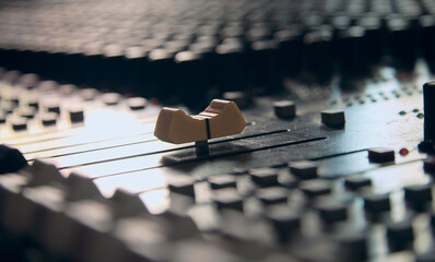 Yellow audio mixing console fader. Professional audio mixing console.