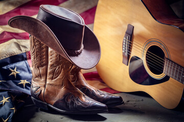 Country music festival live concert with acoustic guitar, american flag, cowboy hat and boots