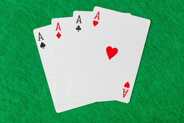Casino playing cards on green table
