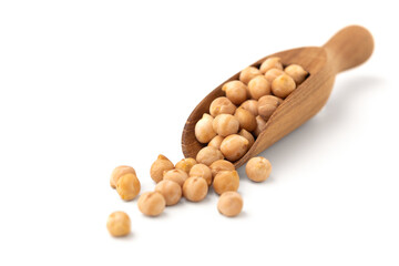 Chickpeas in wooden scoop isolated on white