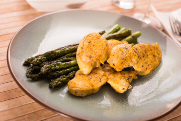 dietary meal rich in protein. Stir fried chicken breast and green asparagus