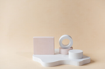 White podium on beige background. Template, mock up for presentation products. Pastel colors styled composition with geometrical forms. Minimal concept. Product podium.