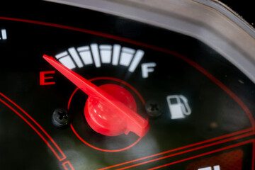 fuel gauge with arrow red indicator level (selective focus)