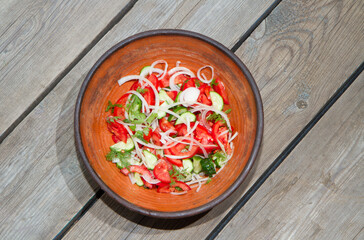 Autumn harvest of vegetables on an old wooden table and an old frying pan.
