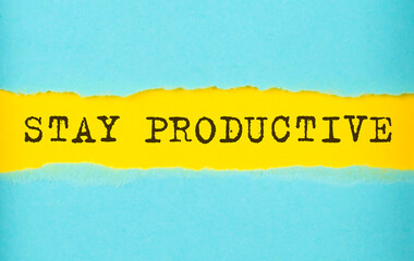 STAY PRODUCTIVE text on the torn paper , yellow background