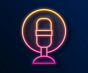 Glowing neon line Microphone icon isolated on black background. On air radio mic microphone. Speaker sign. Vector