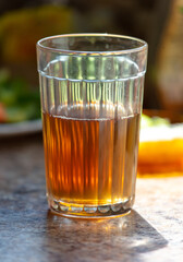 A faceted glass with tea
