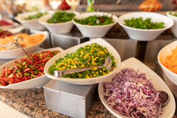 A platter of corn with vegetables in a restaurant.